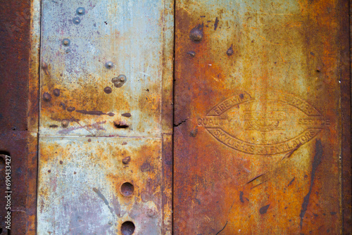 Rustic Industrial Decay - Weathered Metal Surface with Emblem in East St. Louis photo