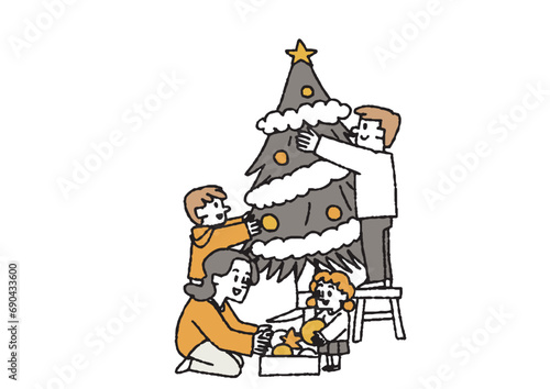 ツリーを飾りつける家族 クリスマスのホームパーティーや家族との時間を楽しむ人々