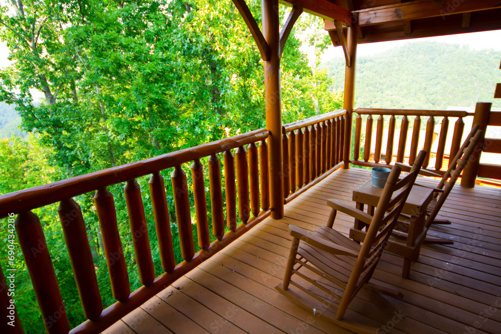 Tranquil Tennessee Porch Overlooking Lush Forest with Rocking Chairs