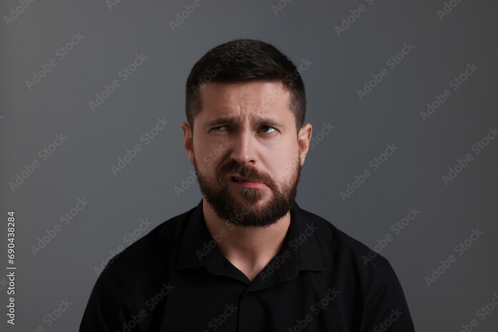 Personality concept. Emotional man on grey background Personality concept. Emotional man on grey background