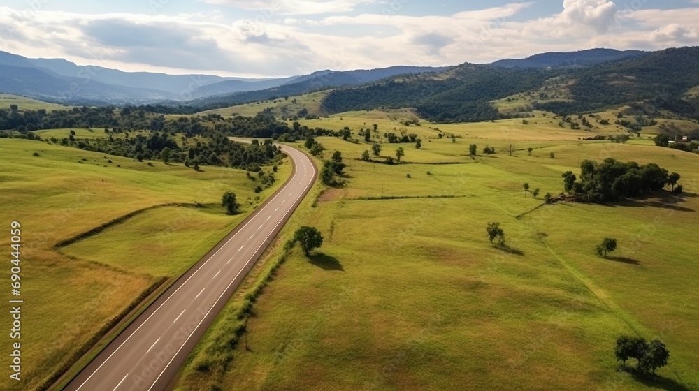Aerial view of a highway passing through green fields 