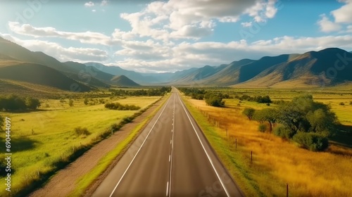 Aerial view of a highway passing through green fields 