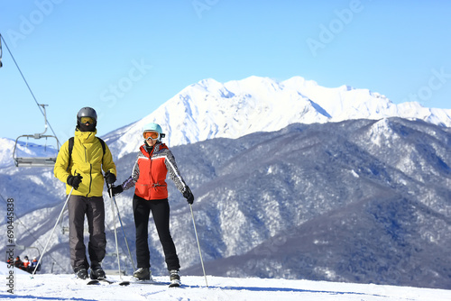 a group of friends skiing in the mountains lifestyle outdoor winter