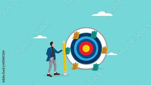 business plan and target achievement illustration with the concept of a businessman attaching plan paper to the archery target face, business target achievement and goal concept, business plan