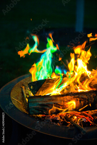 Vibrant Colorful Campfire with green flames - A Closeup Night Perspective