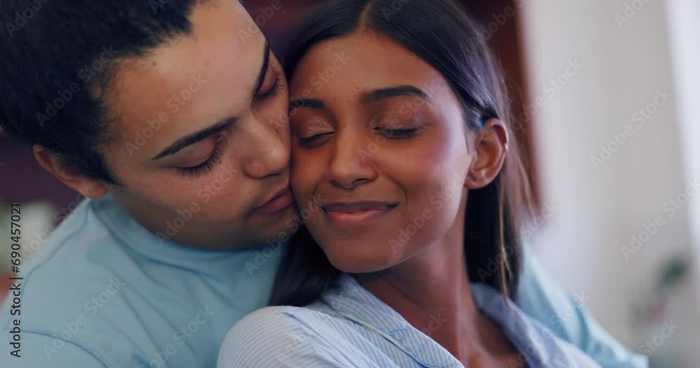 Couple, embrace and kiss on cheek with love or care in marriage, partnership or home. Happy, man and woman hug with kindness, support or trust in interracial relationship together in kitchen or house Couple, embrace and kiss on cheek with love or care in marriage, partnership or home. Happy, man and woman hug with kindness, support or trust in interracial relationship together in kitchen or house