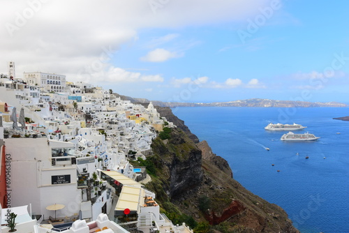 SANTORINI,GREECE-June 20 2023: Oia village, the most picturesque village on Santorini island, a famous touristic resort in the Cyclades islands, Aegean sea, Greece, Europe. This was on a hot sunny day