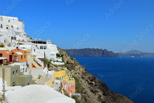 June 18, 2023: Ferry passing the calderea of Fira, Santorini, Cyclades, Greek Islands, Greece, Europe. This was on a sunny day with a clear horizon in this stunning and picture perfect Greek Island.