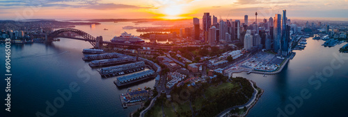Panoramic view of Sydney Harbour, Sydney City and Barangaroo waterfront precinct in Sydney City, NSW Australia during a morning sunrise in December 2023     