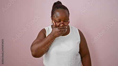 Sneezing african american woman with braids, in glasses and plus size, over pink isolated background, sick from springtime pollen, seasonal allergy nightmare! photo