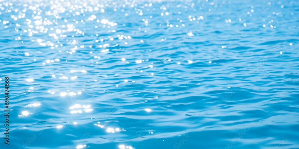 Blue water background with rippling surface