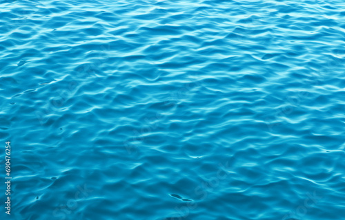 Serene Blue Water Surface with Rippling Waves, Perfect for a Refreshing Swim in Summer © Ohice