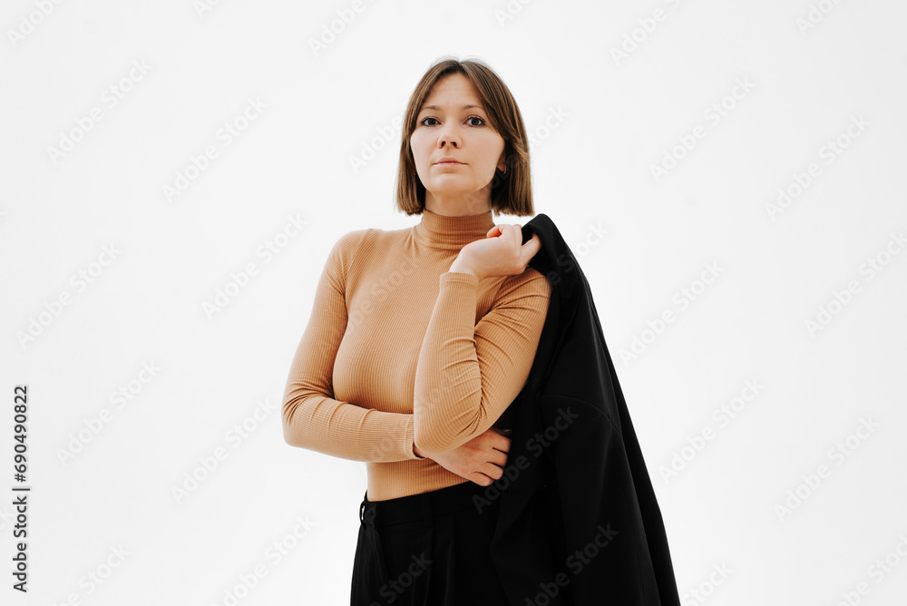 Confident stylish adult Caucasian woman posing on white background Confident stylish adult Caucasian woman posing on white background