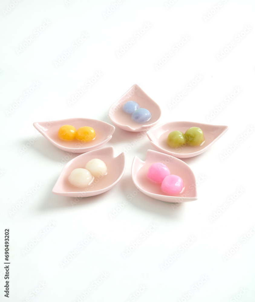 Tangyuan, Glutinous Sweet Balls, Served in Ginger Syrup. a traditional cuisine for Mid-autumn, Dongzhi (winter solstice) and Chinese new year. Selective focus. Tangyuan, Glutinous Sweet Balls, Served in Ginger Syrup. a traditional cuisine for Mid-autumn, Dongzhi (winter solstice) and Chinese new year. Selective focus.
