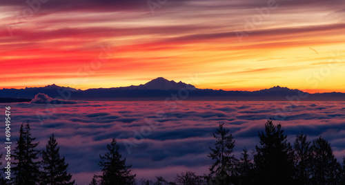 Colorful Sunrise with Vancouver covered in Fog and Mt Baker in Background. © edb3_16