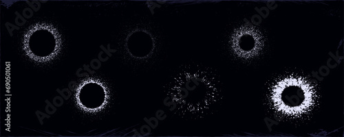 Dot frame round. Splashes of paint in a circle. Splash of white liquid, spraying dots on the sides. Geometric border, spray, drops of paint in the shape of a ring, salute, fireworks, snow. Vector set.