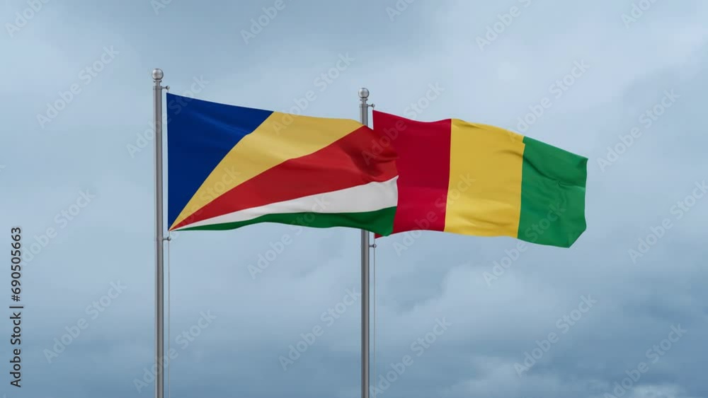 Republic of Guinea flag and Seychelles flag waving together on cloudy sky, endless seamless loop, two country relations concept Republic of Guinea flag and Seychelles flag waving together on cloudy sky, endless seamless loop, two country relations concept