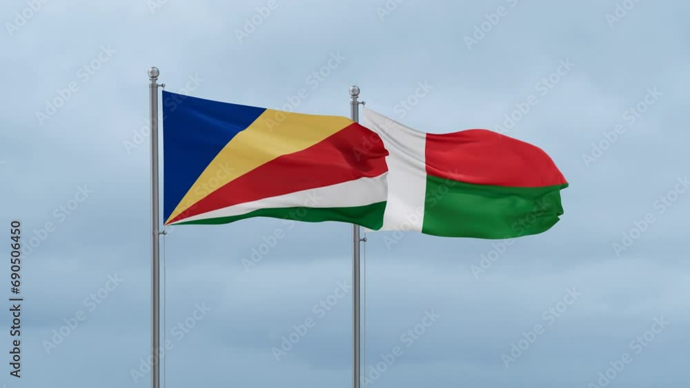 Madagascar flag and Seychelles flag waving together on cloudy sky, endless seamless loop, two country relations concept Madagascar flag and Seychelles flag waving together on cloudy sky, endless seamless loop, two country relations concept