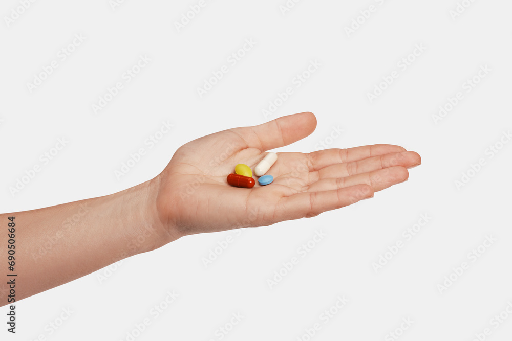 Colorful pills and tablets in the woman hand Colorful pills and tablets in the woman hand