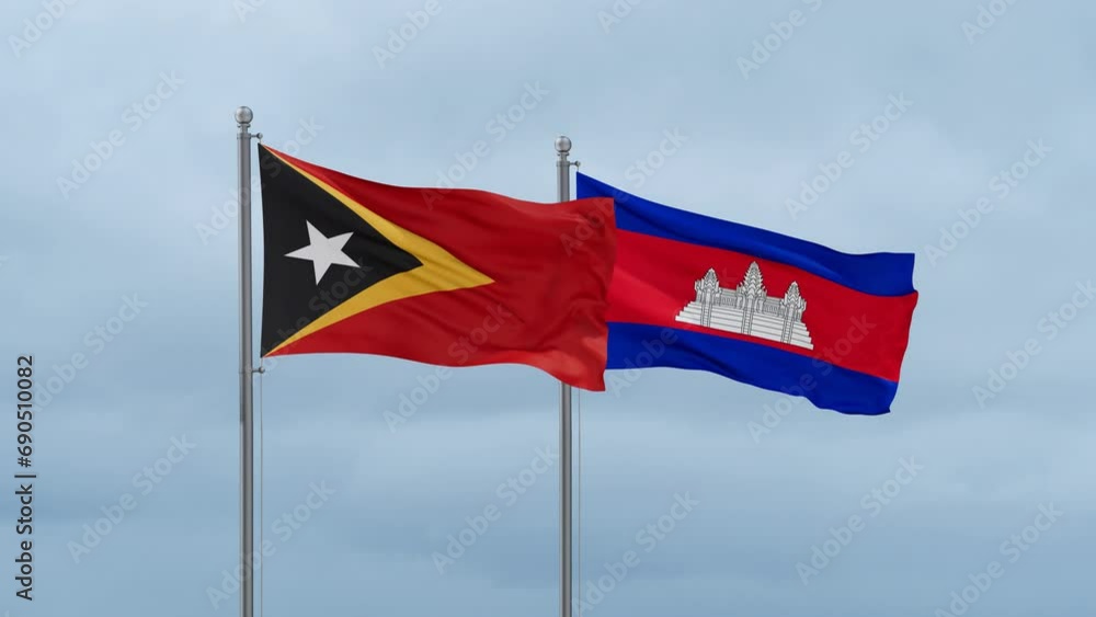 Cambodia flag and Timor flag waving together on cloudy sky, endless seamless loop, two country relations concept Cambodia flag and Timor flag waving together on cloudy sky, endless seamless loop, two country relations concept