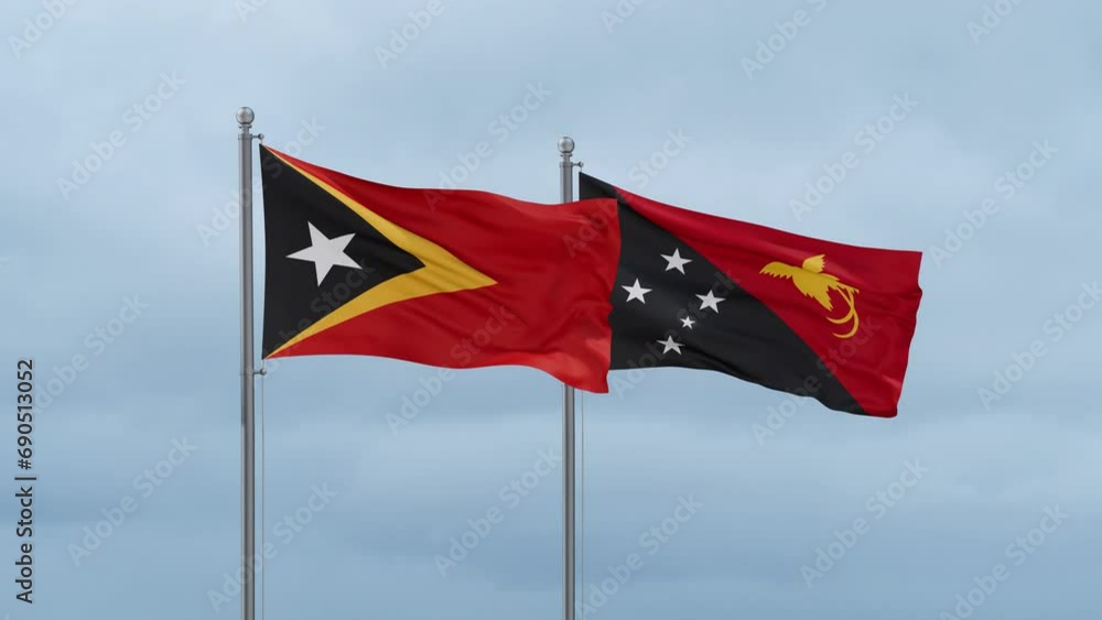 Papua New Guinea flag and Timor flag waving together on cloudy sky, endless seamless loop, two country relations concept Papua New Guinea flag and Timor flag waving together on cloudy sky, endless seamless loop, two country relations concept