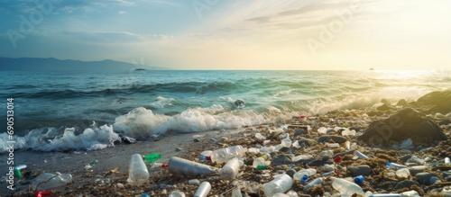 Ocean debris, including plastic waste, polluting the beach.