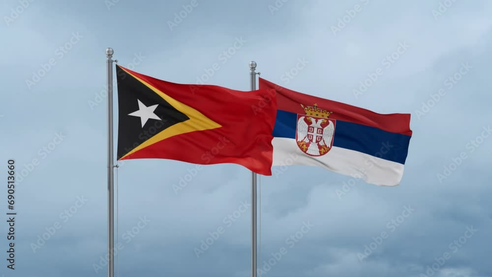 Republic of Serbia and Timor flag waving together on cloudy sky, endless seamless loop, two country cooperation concept Republic of Serbia and Timor flag waving together on cloudy sky, endless seamless loop, two country cooperation concept
