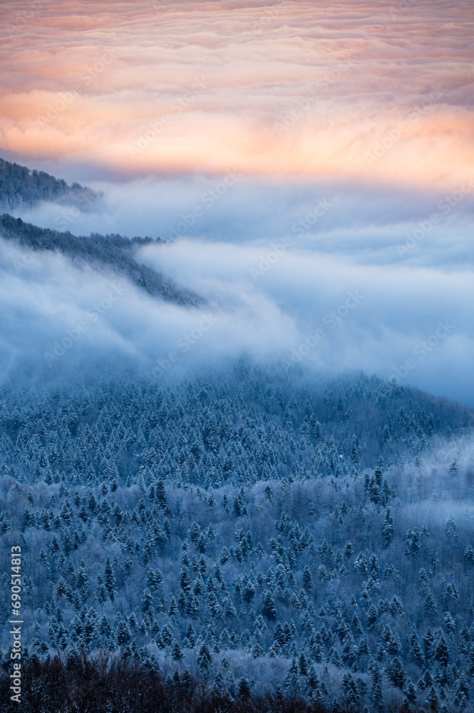 Beautiful winter mountain landscape. Moody sunset seen from the Mount Smerek in the Bieszczady National Park, Poland. Beautiful winter mountain landscape. Moody sunset seen from the Mount Smerek in the Bieszczady National Park, Poland.