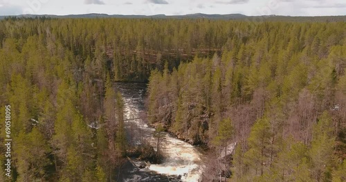 Aerial view of Myllykoski old mill and Myllykoski rapids at Kitkajoki river in spring, Oulanka National Park, Kuusamo, Finland. photo