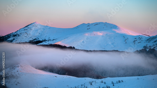 Fototapeta Naklejka Na Ścianę i Meble -  Beautiful winter mountain landscape. Moody sunset seen from the Mount Smerek in the Bieszczady National Park, Poland.