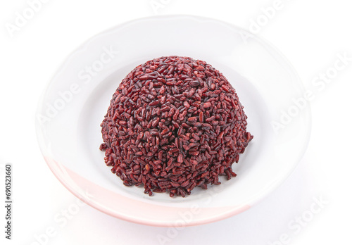 Cooked riceberry in a white plate isolated on white background. Riceberry rice is dark purple rice similar to ripe berries, rich in nutrients and has good anti-oxidant properties. photo