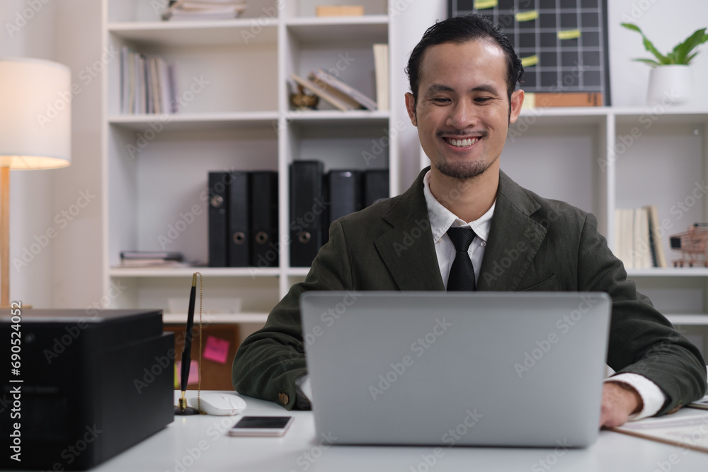 Happy smile professional business man online working, focused ethnic male student working on laptop, remote studying using computer laptop looking at screen watching seminar webinar at home office. Happy smile professional business man online working, focused ethnic male student working on laptop, remote studying using computer laptop looking at screen watching seminar webinar at home office.