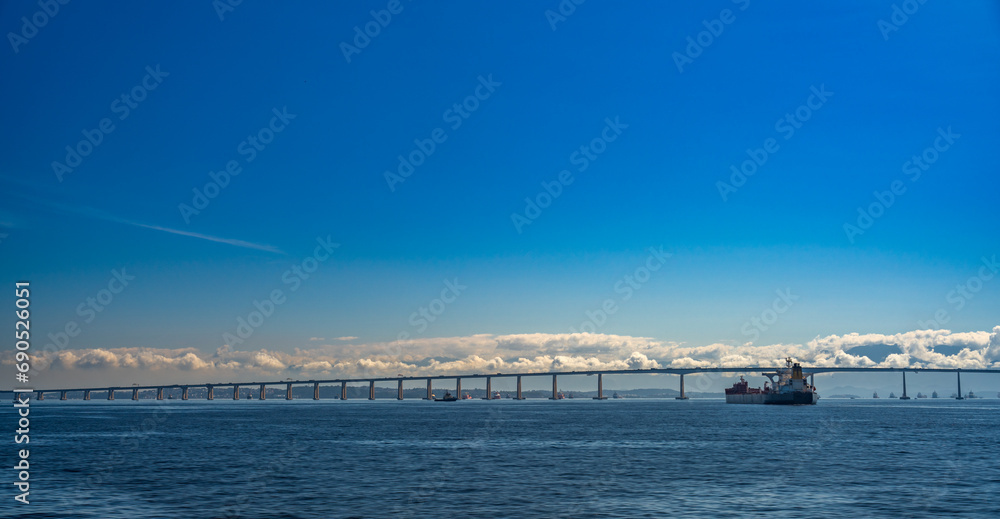 Niteroi Bridge Dominating the Scene Over Container Ships Niteroi Bridge Dominating the Scene Over Container Ships