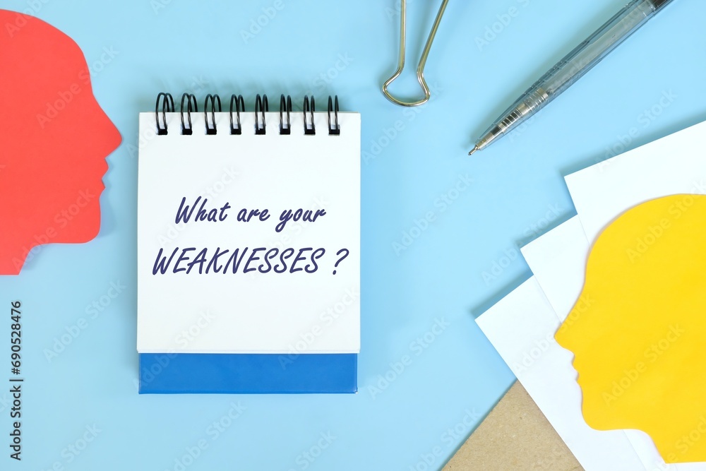 Self awareness and weakness personality concept. Office flat lay composition in blue background.