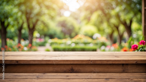 empty wooden desk with blurred background of garden
