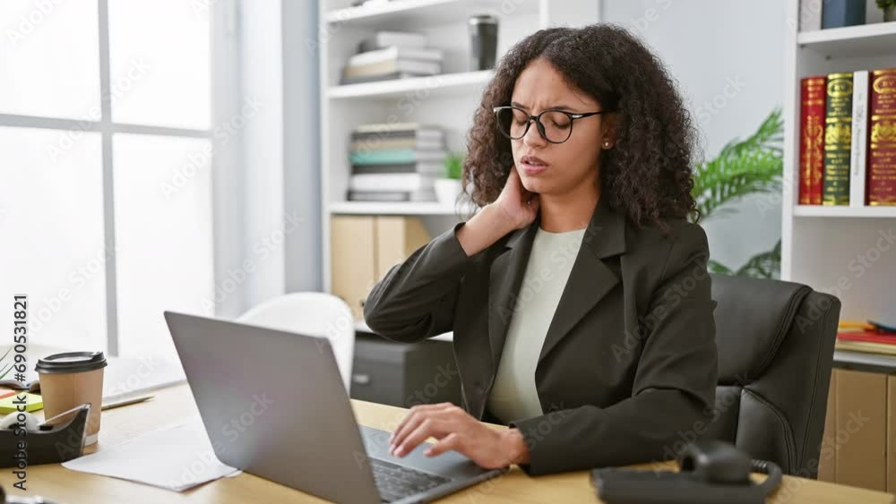 Young hispanic employee suffering cervical pain at work, beautiful woman stressed and unhappy in office interior Young hispanic employee suffering cervical pain at work, beautiful woman stressed and unhappy in office interior