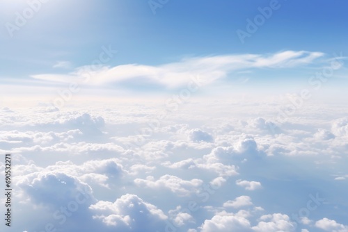 Panoramic morning landscape with vast sky and fluffy clouds seen from a plane.