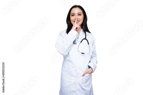 Beautiful young female doctor in white coat with stethoscope asks patients and visitors to be quiet isolated transparent