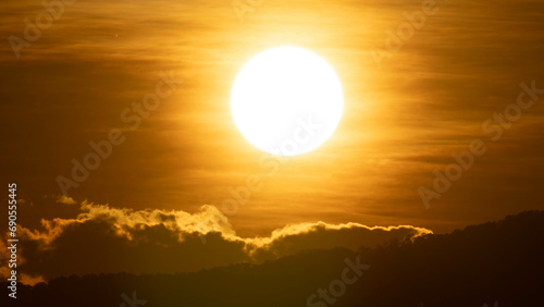 Time lapse of a beautiful nature morning with orange  yellow sunshine and fluffy clouds. Beautiful colorful dramatic sky with clouds at sunset or sunrise.