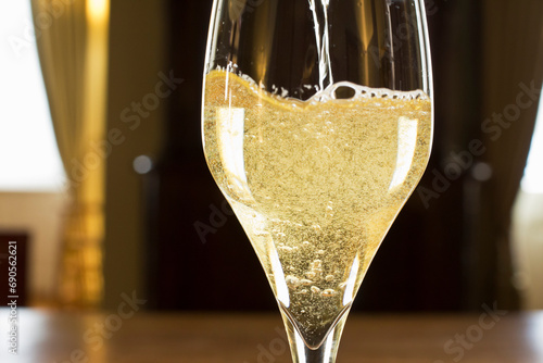 Sparkling champagne in a glass in a dark room