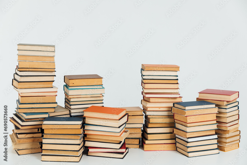 Stacks of old books in study library on white background