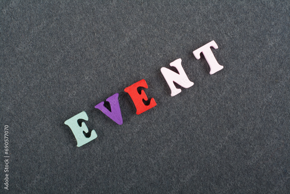 EVENT word on black board background composed from colorful abc alphabet block wooden letters, copy space for ad text. Learning english concept. EVENT word on black board background composed from colorful abc alphabet block wooden letters, copy space for ad text. Learning english concept.
