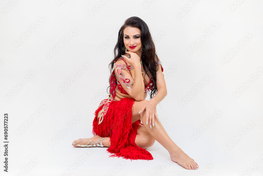Portrait of the head of a female oriental dance studio, red dress, white background. Portrait of the head of a female oriental dance studio, red dress, white background.