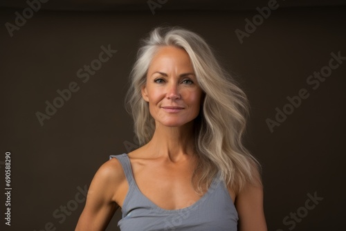 Portrait of a beautiful middle aged woman with long blond hair.