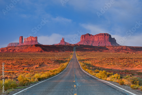 Travel and Tourism - Scenes of the Western United States. Red Rock Formations of Monument Valley at sunrise along highway 163