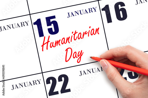 January 15. Hand writing text Humanitarian Day on calendar date. Save the date.