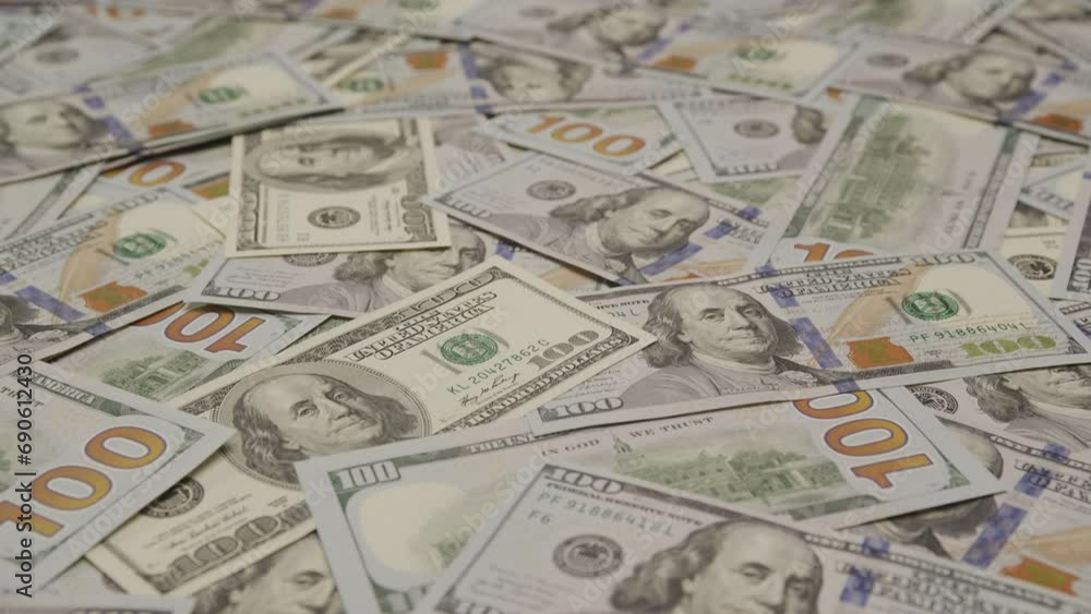 One Hundred Dollar Bills on Desk in Random Order One Hundred Dollar Bills on Desk in Random Order