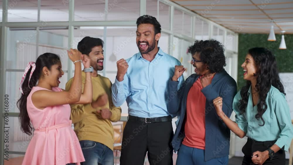 Group of happy excited collogues celebrating team victory after successful project completion or business deal - concept of achievement, collaboration and accomplishment Group of happy excited collogues celebrating team victory after successful project completion or business deal - concept of achievement, collaboration and accomplishment