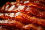 a macro image of a texture of freshly cooked red greasy crispy turkey bacon. Close-up. filling the frame.