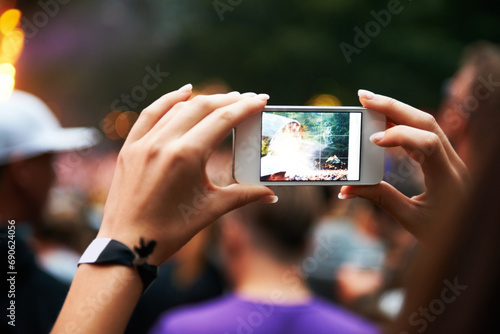 Person, hands and music festival or cellphone picture or entertainment stage, party concert or crowd audience. Woman, fingers and mobile device at performance event, photography or dj celebration